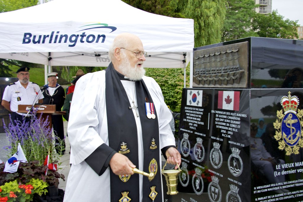 Canon Thomas blessing the Monument 