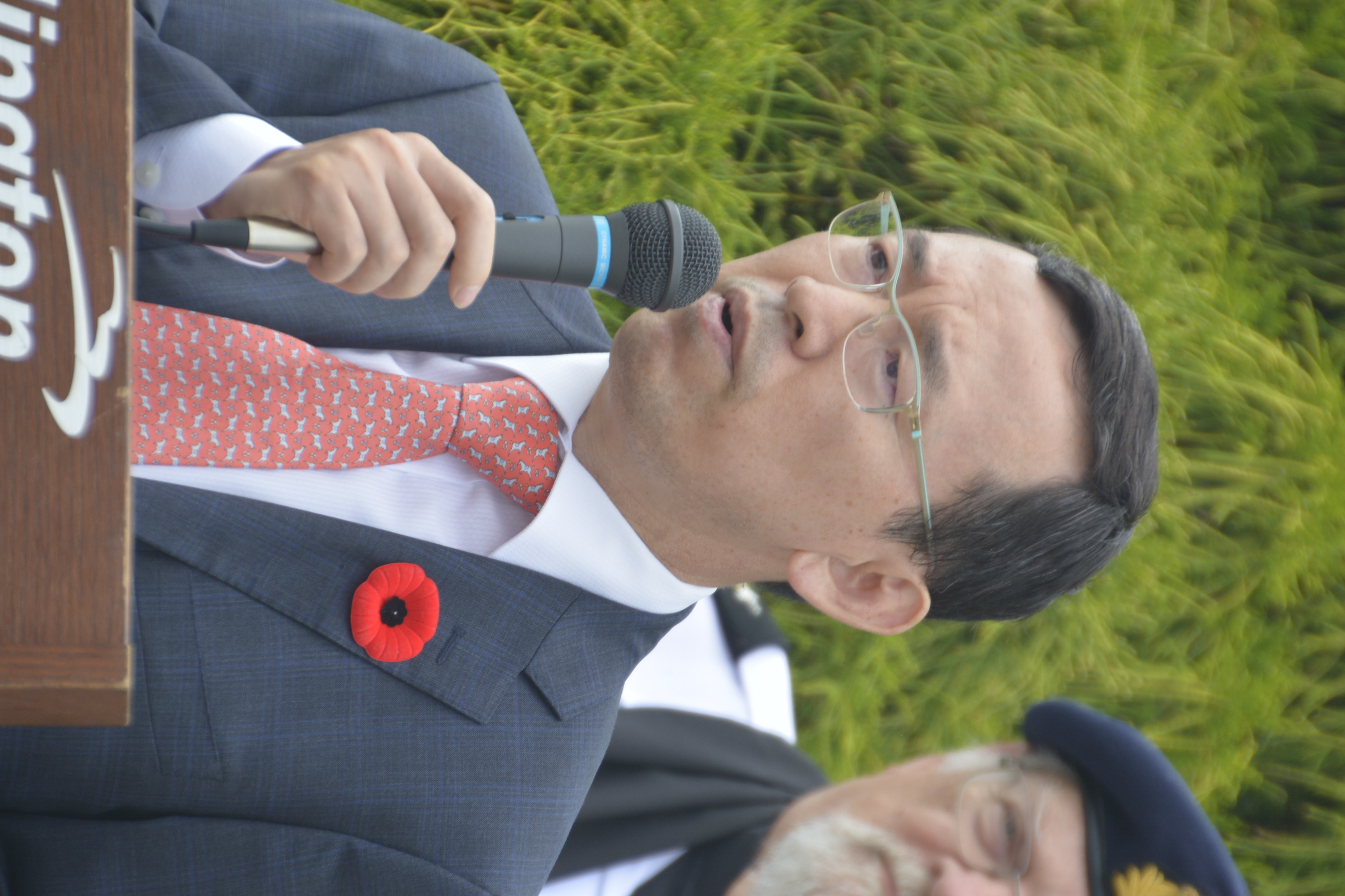 Consul General Kim Duek Hwan addresses the assembly